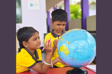 Children learning with a globe
